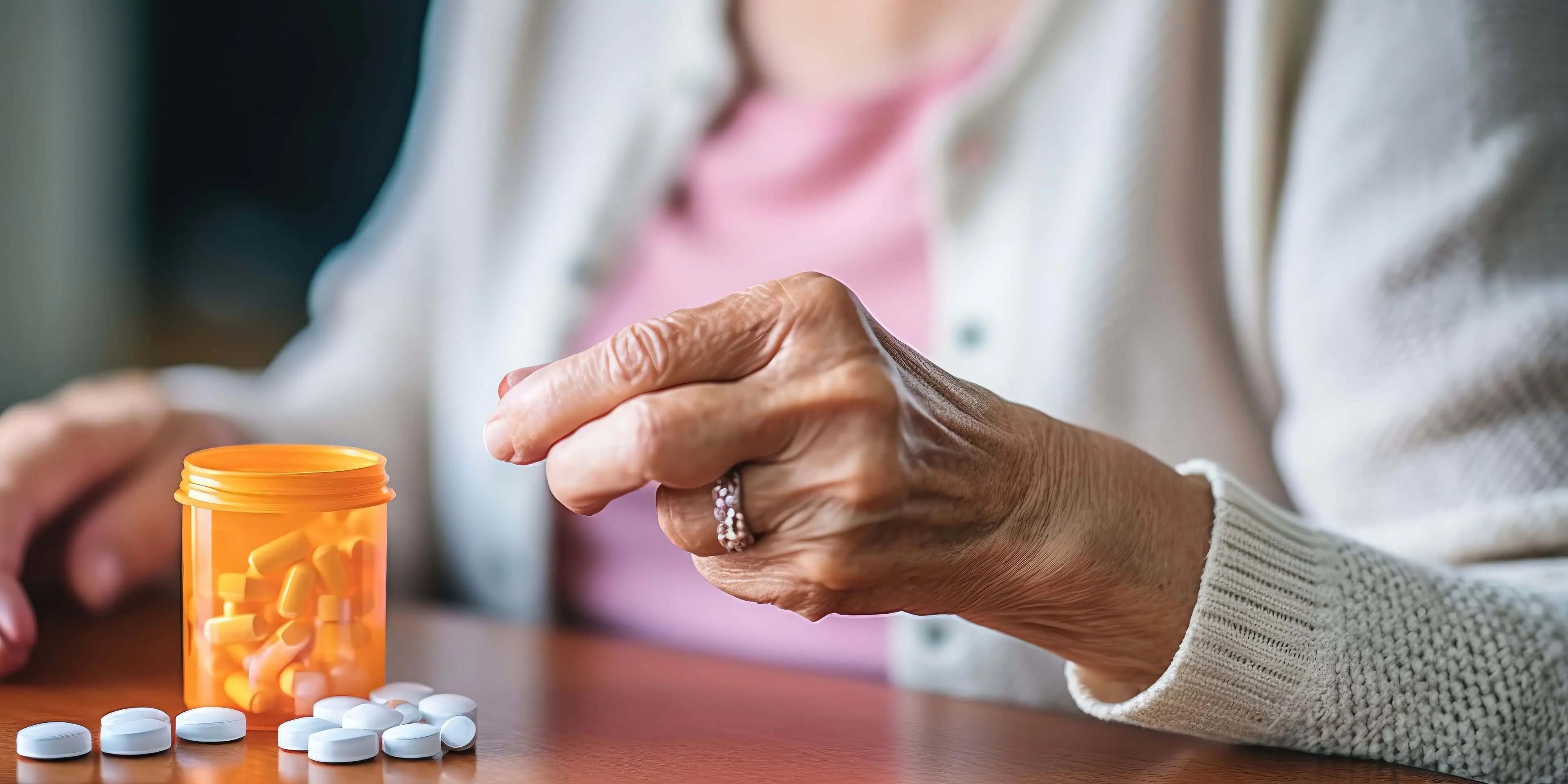 old lady hand holding medication